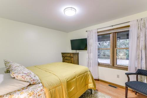a bedroom with a bed and a window at On-Site Lake and Gazebo Cabin in Yellow Springs! in Fairborn