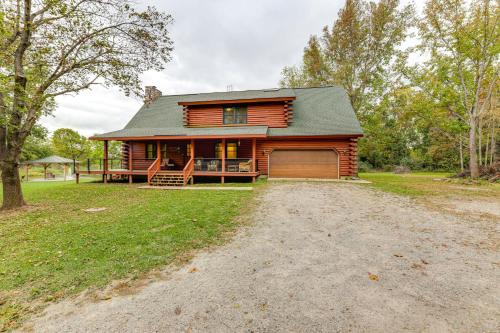 a large log house with a driveway in front of it at On-Site Lake and Gazebo Cabin in Yellow Springs! in Fairborn