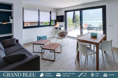 a living room with a couch and a table at Cote Ouest in Sévrier