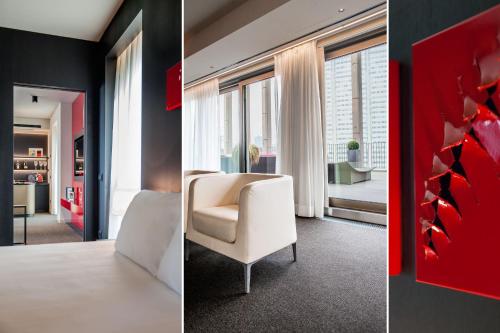 a room with a white chair and a red wall at Glam Milano in Milan