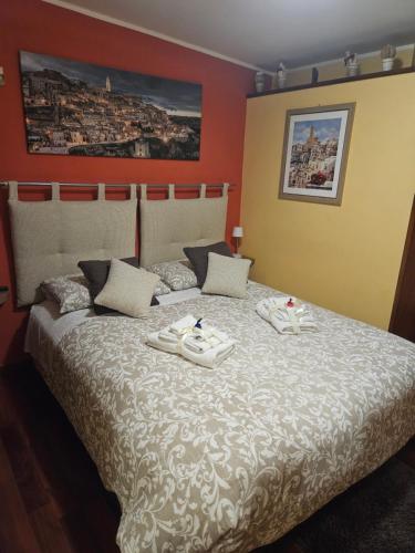 Postel nebo postele na pokoji v ubytování Sassi's Loft