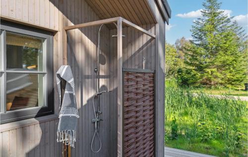 a towel hanging on the side of a building with a door at 3 Bedroom Stunning Home In Rødby in Rødby