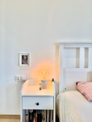 a bedroom with a bed and a nightstand next to a bed at Lovemate space in Varna City