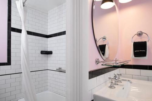 a bathroom with a sink and a shower at Sapphire Motel Midtown Bozeman in Bozeman