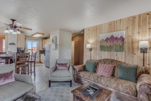 a living room with two couches and a kitchen at Knapsack in Clark