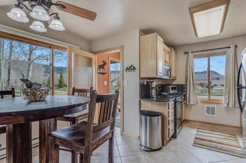 a kitchen with a table and chairs and a counter top at Knapsack in Clark