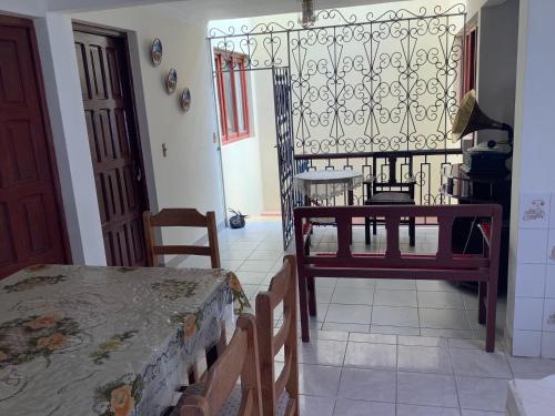 a room with a table and a table and a chair at Rovira Viajes y Turismo in Tupiza