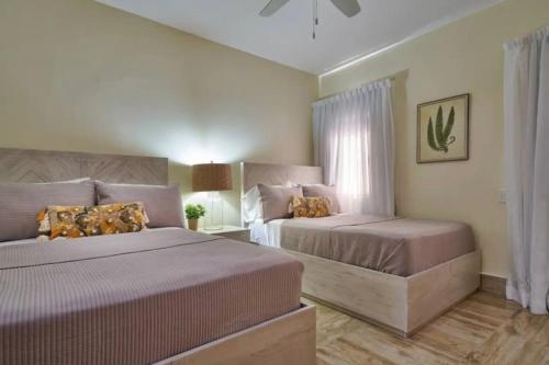 Ένα ή περισσότερα κρεβάτια σε δωμάτιο στο Beach Apartament with sea views Punta Cana