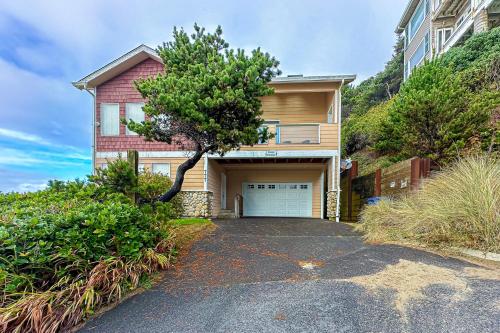 a house with a garage on a hill at The Beach House in Lincoln City