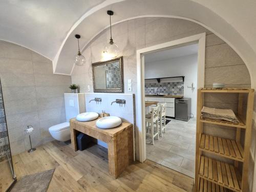 a bathroom with a sink and a toilet at Apartment Zoe - Old Town in Bratislava