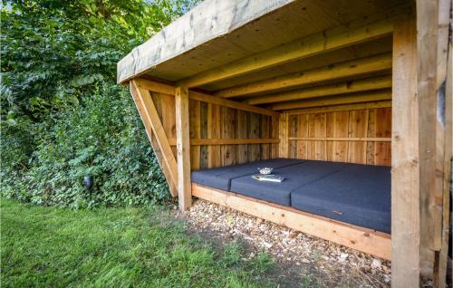 a wooden sauna with a bed in it at 3 Bedroom Cozy Home In Ørsted in Ørsted