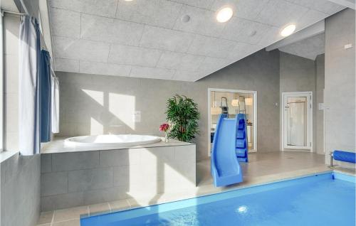 a bathroom with a swimming pool and a sink at Nice Home In Sydals With Kitchen in Sarup
