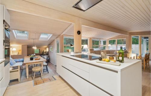 an open kitchen and living room with a counter top at Stunning Home In Nexø With Kitchen in Vester Sømarken
