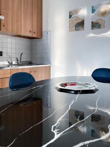 a kitchen with a counter top with a plate on it at Smart Residence Aviano in Aviano