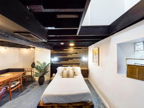 a room with two beds and a table in it at Chi-Town Ultimate Hideout 1-2-3 in Berwyn
