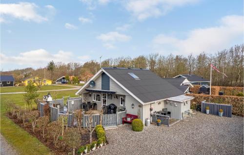 a white house with a black roof at 2 Bedroom Nice Home In Hemmet in Hemmet