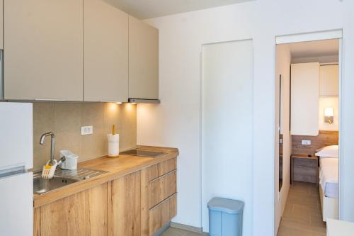 Ένα ή περισσότερα κρεβάτια σε δωμάτιο στο Arti Homes Rab