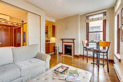 a living room with a couch and a table at Walk to Convention Center, Secured Apt in Columbus in Columbus