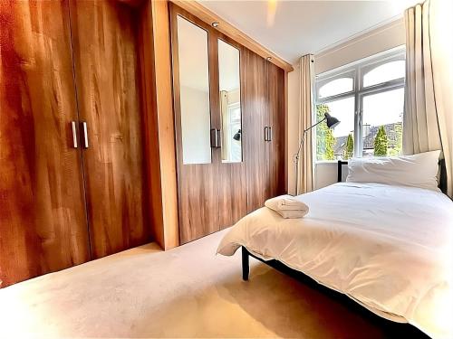 a bedroom with a bed and a window at Retreat in Tulfarris County Wicklow - Ireland in Blessington