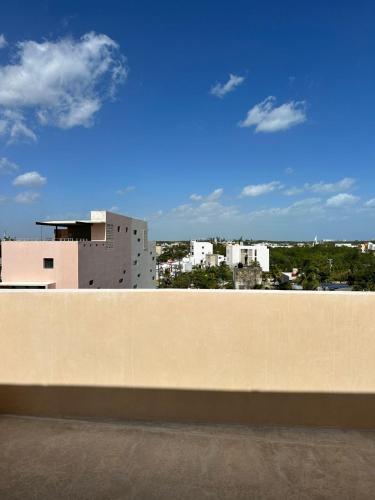 a view of a city from the top of a wall at Chichén 27 Departamentos nuevos con piscina cerca de Ferry a Isla Mujeres in Cancún