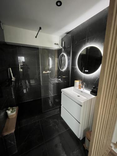 Koupelna v ubytování Le Duplex de la côte