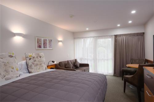Postel nebo postele na pokoji v ubytování Dunedin Leisure Lodge - Distinction