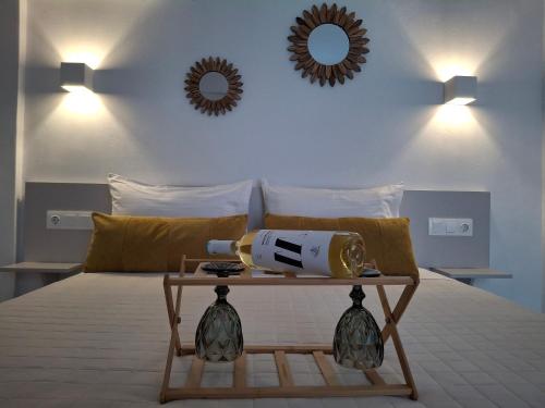 a room with a bed with a telescope on it at Aegean Whisper in Masouri