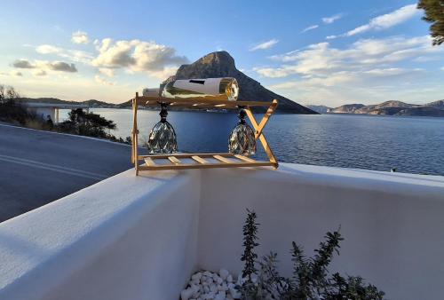 a camera on top of a wall with a view of the water at Aegean Whisper in Masouri