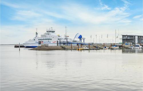 a large cruise ship docked at a dock at Amazing Home In Rømø With Kitchen in Havneby