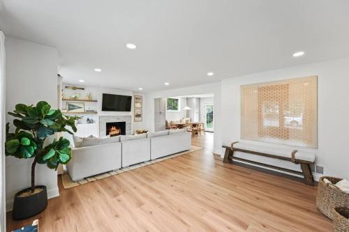 a living room with a couch and a fireplace at Sea Girt Beach House in Sea Girt