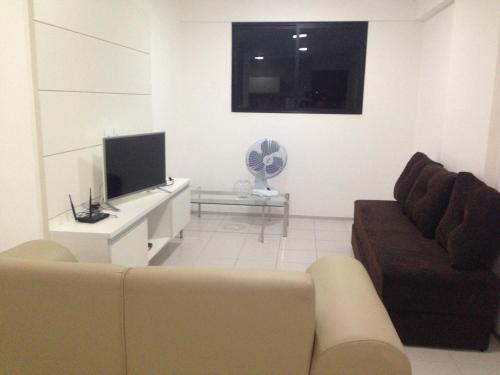 TV at/o entertainment center sa Apartamento Edifício Setai