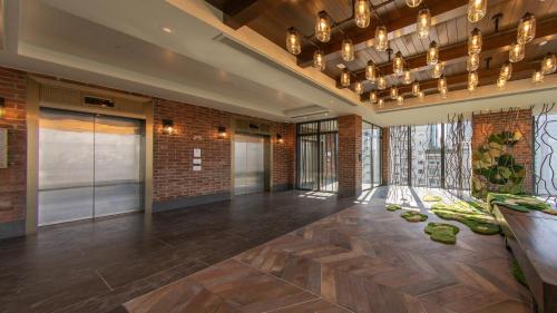 a lobby of a building with a large room at Hotel Indigo Kuala Lumpur on the Park by IHG in Kuala Lumpur