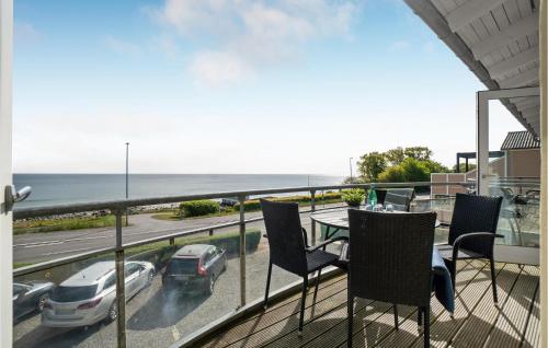 a balcony with chairs and a view of the ocean at Awesome Apartment In Allinge With Wifi in Allinge