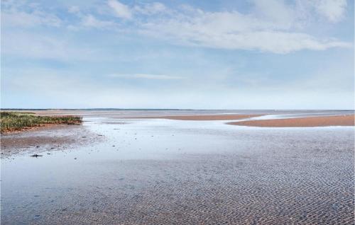 a large body of water with rocks in the water at Beautiful Home In Ørsted With Wifi in Ørsted
