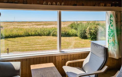 a window in a room with a view of a field at Three-Bedroom Holiday Home In Karrebaksminde in Karrebæksminde