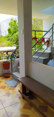 a room with a bench on a balcony with stairs at Casa de Campo y Hospedaje Irma in Lunahuaná