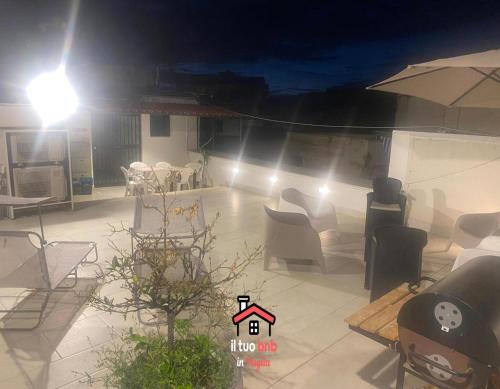 a view of a living room at night with lights at Casa Bianca bnb,Big Terrace,10 min Airport Beaches in Bitonto