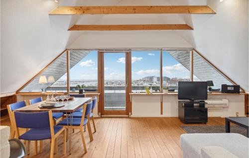 a dining room with a view of the water at Apartment Bogense With Sea View V in Bogense