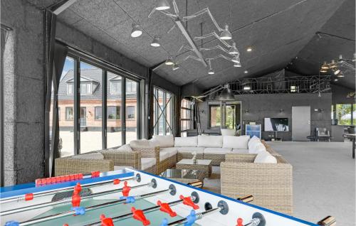a large living room with a large pool table at Gubbegård in Neksø