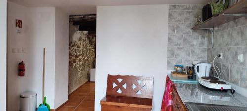 a kitchen with a sink and a counter top at Raposeira Bed & Breakfast in Maçãs de Dona Maria
