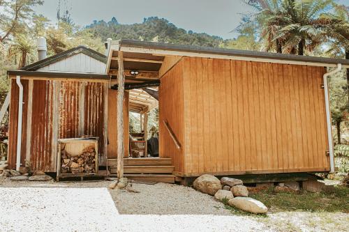 a house that is being remodeled with wood at Golden Bay Glamping in Takaka