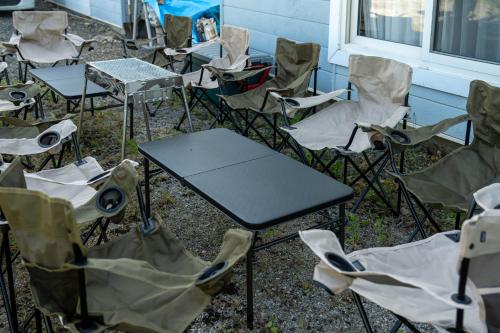 a group of chairs and tables and a table at The Jardin in Kami-furano