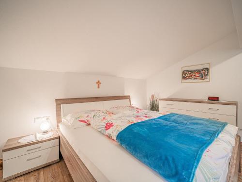 a bedroom with a bed and two night stands at Gastl in Hopfgarten im Brixental