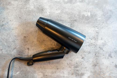 a black flashlight sitting on top of a table at The Chateau in Yoichi