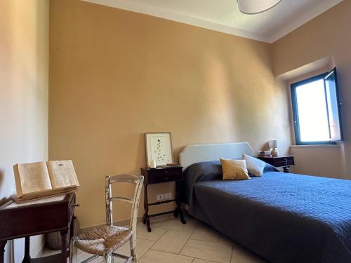 Postel nebo postele na pokoji v ubytování Locanda Val d'Orcia