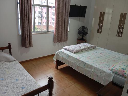 Postel nebo postele na pokoji v ubytování Hotel Pousada das Rosas