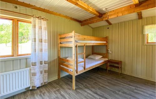 a bedroom with a bunk bed in a house at Nice Home In Älvsered With Wifi in Älvsered