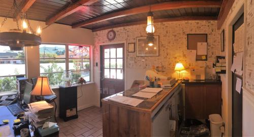 a kitchen with a counter top in a room at Buffalo Chip's Ranch House Motel in Bonita Springs