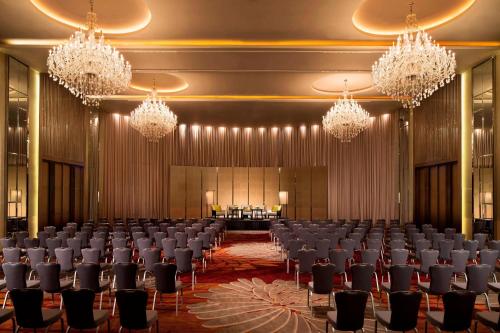 a conference room with chairs and chandeliers at Bangkok Marriott Hotel Sukhumvit in Bangkok