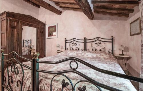 a bedroom with a large bed in a room at Beautiful Apartment In Loc, Scalabrelli in Catabbio